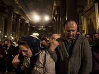 Believers during an Orthodox Easter service in Kazansky Cathedral. Saint Petersburg, Russia, on April 19, 2014. (