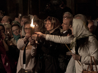 Believers during an Orthodox Easter service in Kazansky Cathedral. Saint Petersburg, Russia, on April 19, 2014. (