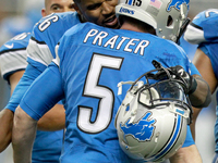 Detroit Lions kicker Matt Prater (5) is congratulated by strong safety Don Carey (26) after kicking the game winning field gold against the...