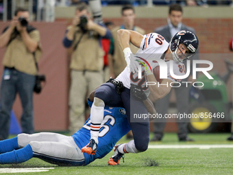 Chicago Bears wide receiver Marc Mariani (80) gets tackled by Detroit Lions strong safety Don Carey (26) during the overtime period of an NF...