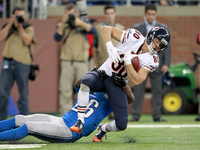 Chicago Bears wide receiver Marc Mariani (80) gets tackled by Detroit Lions strong safety Don Carey (26) during the overtime period of an NF...