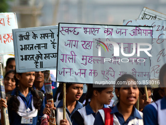 Indian School girls take part in National Mission For Clean Ganga (NMCG) rally on the banks of River Ganges,in Allahabad on October 20,2015....