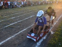 A tribal Naga man pushes a cart as they make way during an indigenous cart rally at the Ao Students Union Dimapur Sport Meet in Dimapur, Ind...