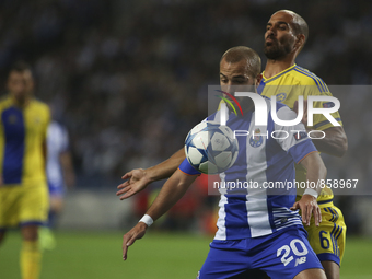 Porto's Portuguese midfielder André André and Maccabi Tel Aviv's Israeli midfielder Gal Alberman during the UEFA Champions League match betw...