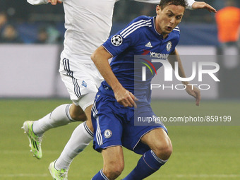 Serhiy Sydorchuk (L) of Dynamo vies for the ball with Nemanja Matic (R) of Chelsea during the UEFA Champions League Group G soccer match bet...