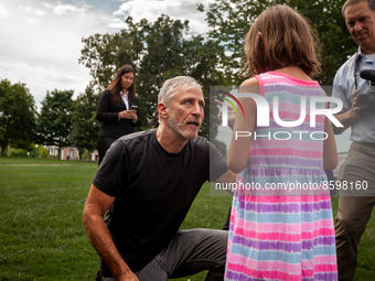 Veterans advocate Jon Stewart talks with Brielle Robinson, 9, following a press conference on the Republican defeat of the Honoring Our PACT...