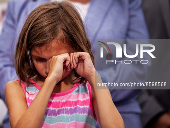 Brielle Robinson,9, reacts to her grandmother's remarks about her father's death from a rare cancer during a press conference condeming Repu...