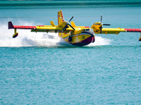 A Canadair of the Fire Brigade during water refuelling in Lago del Salto, an artificial reservoir often used by aerial vehicles for water re...