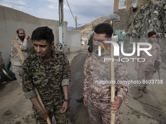 Members of the Islamic Revolutionary Guard Corps (IRGC) arrive at the flooded village of Imamzadeh Davood in the northwestern part of Tehran...