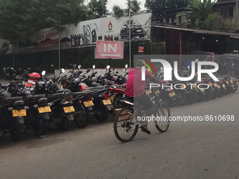 Motorcycles are parked in front of a Ceylon Petroleum Corporation fuel station in Colombo, Sri Lanka, hoping to buy fuel on July 31, 2022, w...