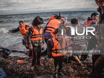 Children with their lifejackets still on after embarking on the Greek island of Lesbos, on September 29, 2015.  (
