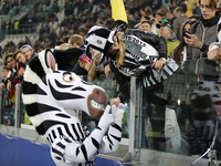the public an the mascotte of juventus team before champions league match between juventus fc and Borussia Monchengladbach at the juventus s...