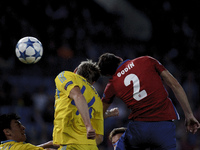 SPAIN, Madrid:Atletico de Madrid's Uruguayan Defender Diego Godin and Astana´s Kazakhstani Defender Evgeni Postnikov during the UEFA Champio...