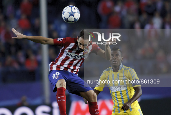 SPAIN, Madrid:Atletico de Madrid's Spanish Defender Juanfran Torres and Astana´s Central African midfielder Foxi Kéthévoama during the UEFA...