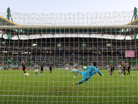 Sporting's forward Fredy Montero (C ) scoring a penalty to Sknderbeu's goalkeeper Orges Shehi during the UEFA Europa League Group H football...
