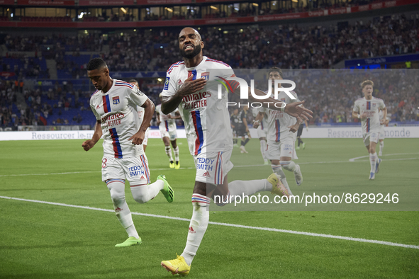 Alexandre Lacazette of Olympique Lyonnais celebrates after scoring his sides first goal during the Ligue 1 match between Olympique Lyonnais...