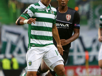Sporting's forward Fredy Montero (L ) vies with Sknderbeu's midfielder Bakary Nimaga during the UEFA Europa League Group H football match be...