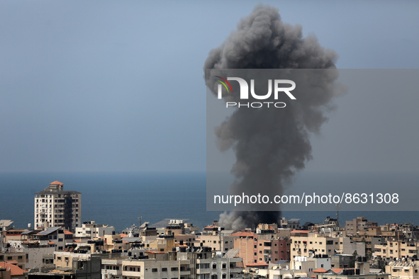 Smoke billows from an Israeli air strike in  Gaza City, on August 6, 2022.  