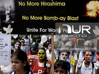 Students carry banners depicting slogans like 'No More Hiroshima' and 'We want to grow, not to blow up' and placards, banners, flags depicti...