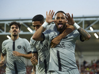 Neymar of PSG celebrates after scoring his sides first goal during the Ligue 1 match between Clermont Foot and Paris Saint-Germain at Stade...