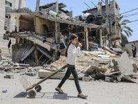 A Palestinian girl walks next to rubble of house destroyed by Israeli airstrikes in Gaza City, on 07 August 2022.  (
