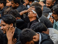 Shi'ite Muslim mourners react during a Muharram procession to mark Ashura in Kolkata on August 09, 2022. After a gap of two years due to COV...