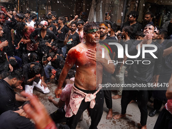 Shiite Muslims flagellate themselves during a Muharram procession marking Ashura, in the old quarters of Delhi, India on August 9, 2022. Ash...