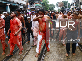 Shi'ite Muslims flagellate themselves during a Muharram procession marking Ashura in Kolkata on August 9,2022. After a gap of two years due...