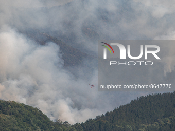 A water bomber helicopter is mobilized on a major forest fire that broke out near the town of Romeyer in the Diois massif located in the Drô...