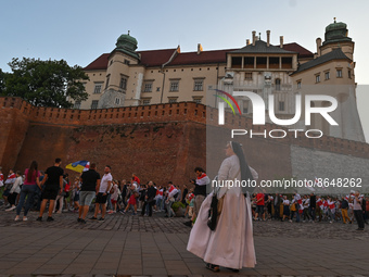 A local nun watches the protest outside Wawel Castle.
Members of the local Belarusian and Ukrainian diaspora supported by local Cracovians d...