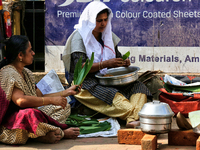 Hindu women finish final preparations before cooking pongala along the roadside on the morning of the final day of the 10 day-long Attukal P...