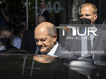 German Chancellor Olaf Scholz leaves after holding a press conference at the Bundespressekonferenz in Berlin, Germany on August 11, 2022. (
