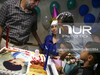 A Palestinian child Adham Saleh, 8, who was wounded during the latest fighting between Israel-Gaza , celebrate his birthday in at al-Shifa h...