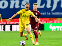 Luka Simunovic in action against Claudiu Petrila (R) during UEFA Europa Conference League, 3rd preliminary round: CFR Cluj v. Şahtior Soligo...