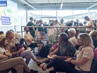Crowds of passengers at the departing gates area. Waiting times fluctuate at Dutch airports during morning peak travel day time as passenger...