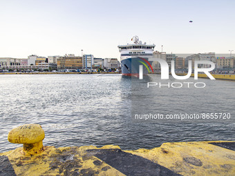 Blue Star Paros docked at the Port of Piraeus carrying passengers from Cyclades islands, Aegean Sea. Passengers and vehicles are disembarkin...