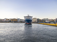 Blue Star Paros docked at the Port of Piraeus carrying passengers from Cyclades islands, Aegean Sea. Passengers and vehicles are disembarkin...
