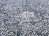 Aerial view from an airplane window of Athens Olympic Sports Complex Spiros Louis and urban area of Athens. The area is a sport facilities c...