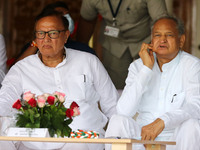 Jaipur:Rajasthan Chief Minister Ashok Gehlot with State Education Minister B.D. Kalla during a patriotic song singing programme organised to...