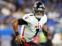 Quarterback Marcus Mariota (1) of the Atlanta Falcons carries the ball during an NFL preseason football game between the Detroit Lions and t...