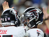 Quarterback Marcus Mariota (1) of the Atlanta Falcons is congratulated after making a touchdown during an NFL preseason football game betwee...