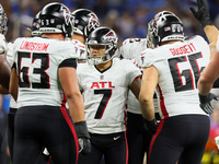 Place kicker Younghoe Koo (7) of the Atlanta Falcons is congratulated by teammates after making his kick for the extra point during an NFL p...