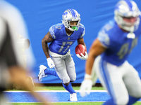 Wide receiver Trinity Benson (17) of the Detroit Lions carries the ball for yardage during an NFL preseason football game between the Detroi...
