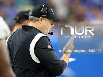 Head coach Arthur Smith of the Atlanta Falcons looks over his play sheet during an NFL preseason football game between the Detroit Lions and...