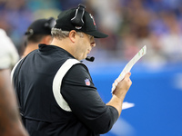 Head coach Arthur Smith of the Atlanta Falcons looks over his play sheet during an NFL preseason football game between the Detroit Lions and...