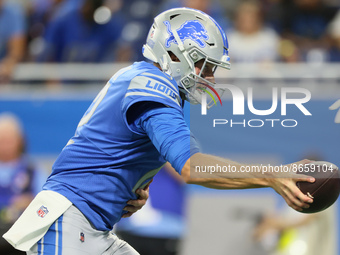 Quarterback Tim Boyle (12) of the Detroit Lions hands off the ball during an NFL preseason football game between the Detroit Lions and the A...