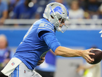 Quarterback Tim Boyle (12) of the Detroit Lions hands off the ball during an NFL preseason football game between the Detroit Lions and the A...