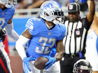 Detroit Lions running back D'Andre Swift (32) scores a touchdown during the first half of an NFL preseason football game against the Atlanta...