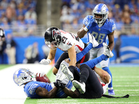 Detroit Lions wide receiver Trinity Benson (17) is tackled by Atlanta Falcons fullback Keith Smith (40) during the first half of an NFL pres...