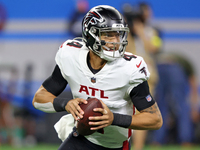 Atlanta Falcons quarterback Desmond Ridder (4) looks to pass during the second half of an NFL preseason football game against the Detroit Li...